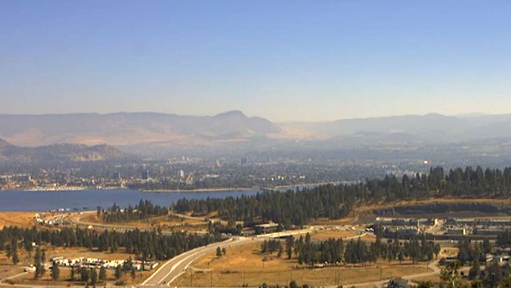 A view of Kelowna and Okanagan Lake on Wednesday. The provincial government says smoke concentrations have improved in many areas since Tuesday, but that some smoky sections are still being observed.