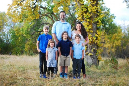 Sarah Wallace, a full-spectrum doula, with her partner and four children.