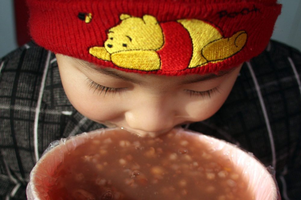 A child eats laba porridge in this Jan. 3, 2009 file photo from China.