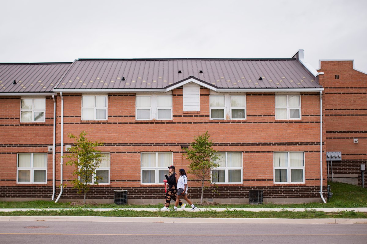 Brock University students walk through the Village Residence complex on campus in St. Catharines, Ont. Tuesday, September 8, 2020.