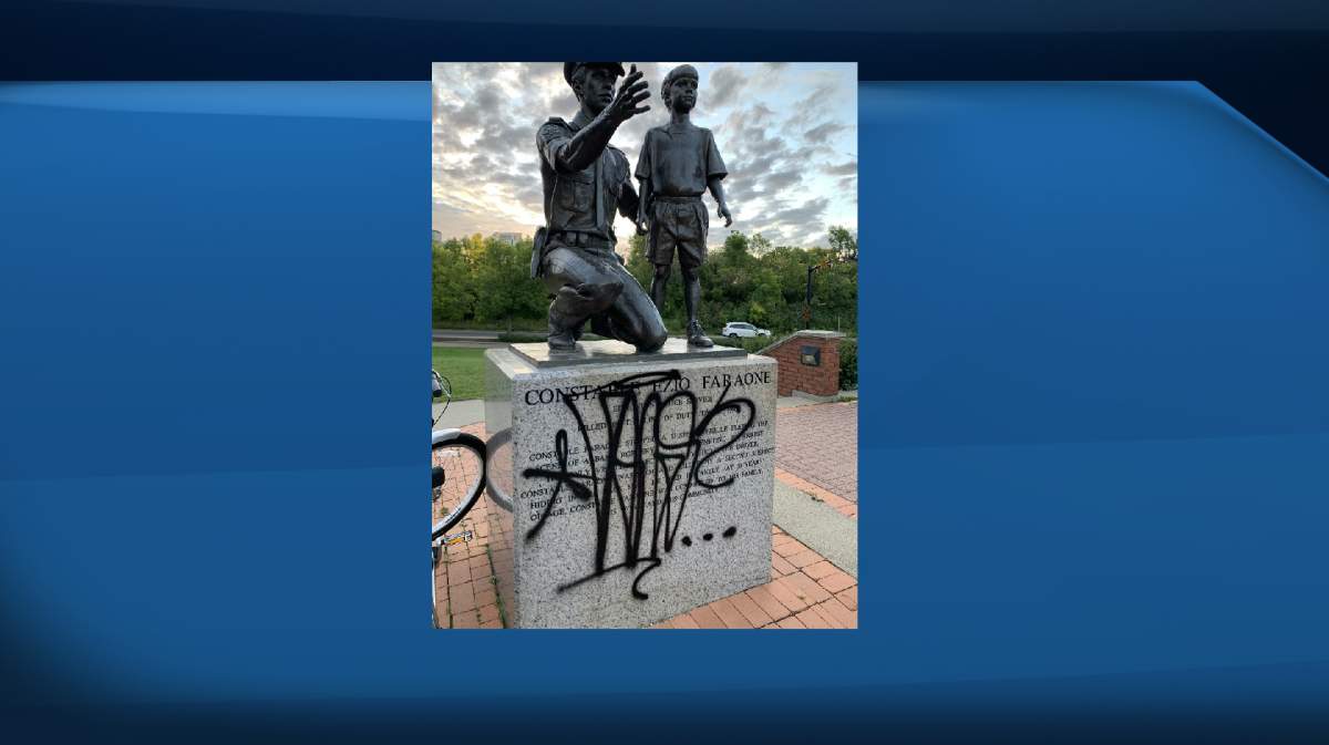 A statue dedicated to fallen EPS Const. Ezio Faraone was covered in graffiti Friday, Sept. 4, 2020.