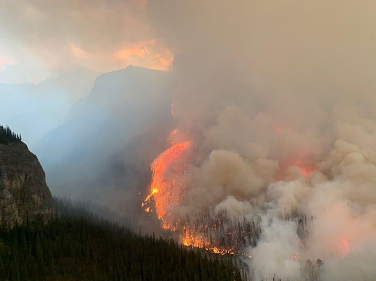Fire officials said Sunday that some of the growth of a wildfire north of Banff National Park is due to controlled burns as part of the battle to stop the fire.