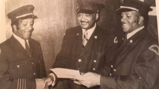 An undated photo of three members of the Upper-Hammonds Plains Volunteer Fire Department