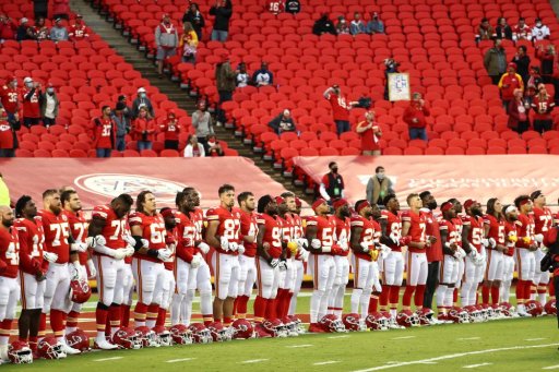 Members of the Kansas City Chiefs stand united for with locked arms before the start of a gam against the Houston Texans at Arrowhead Stadium on September 10, 2020 in Kansas City, Missouri.