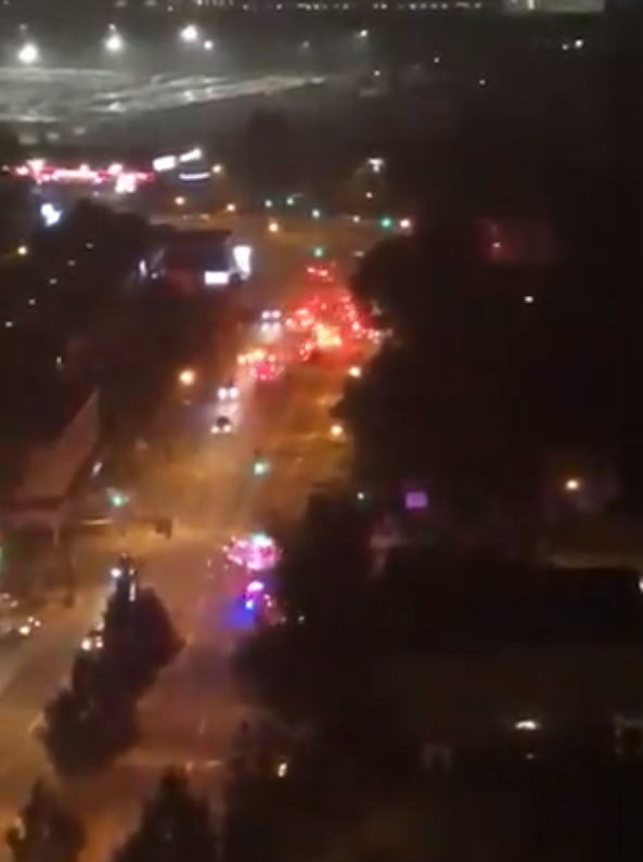 Vancouver fire crews and emergency services converge on Granville Street near West 70th Avenue to deal with a fire in a top floor suite of a residential building Thursday night.