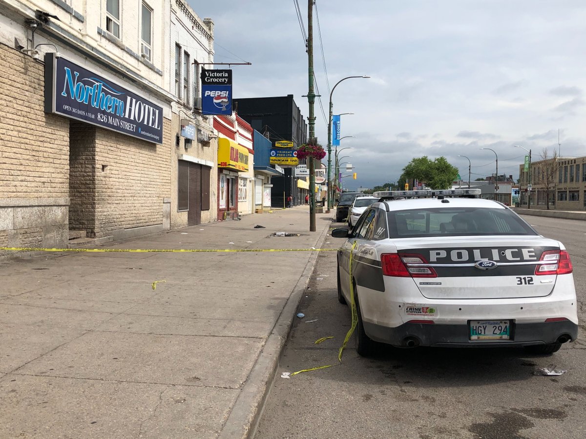 Winnipeg police on Main Street investigating a homicide in July.