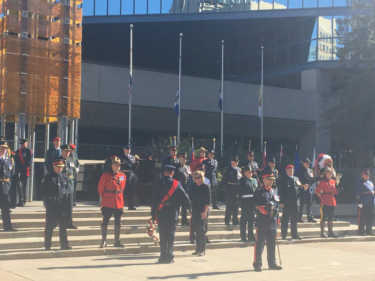 Maryanne Pope lays a wreath at Alberta Police and Peace Officers Memorial Day event in Calgary.