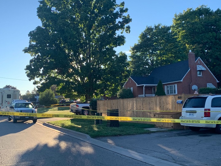Police tape surrounds the home on Parklane Avenue in Oshawa.