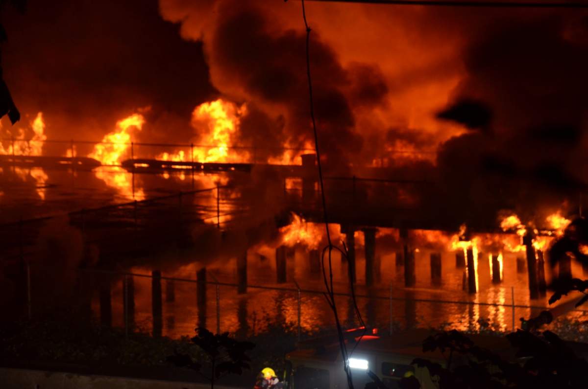 Flames are seen at the height of New Westminster's Pier Park fire on Sunday, Sept. 13, 2020.