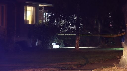 Yellow police tape can be seen at the scene of a 64th Avenue residence at the centre of their investigation into a possibly fatal shooting.