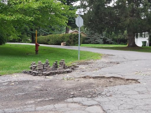 Rock sculptures stand on Maple Street.