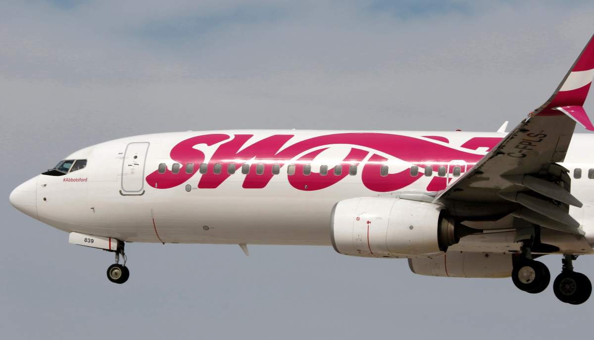A Boeing 737 (737-800) jetliner, belonging to low-cost carrier Swoop, lands at McCarran International Airport in Las Vegas, on Tues., Feb. 26, 2019.