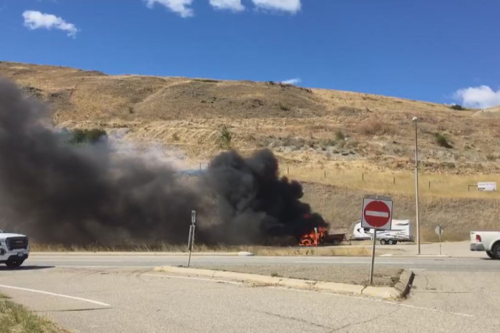 Grass fire on Highway 97 sparked by burning vehicle