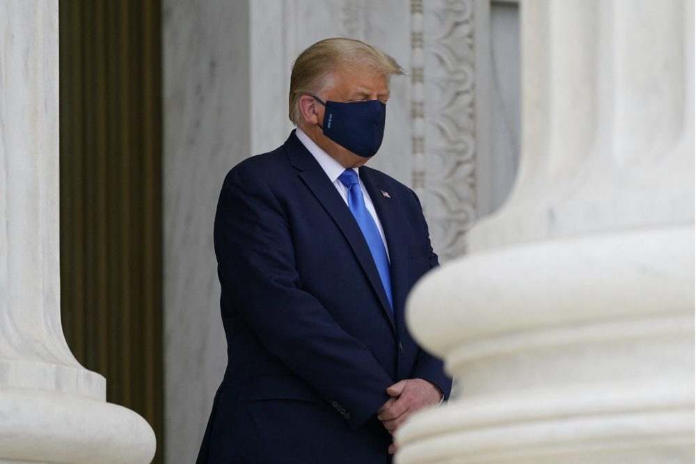 U.S. President Donald Trump pays respects as Justice Ruth Bader Ginsburg lies in repose under the Portico at the top of the front steps of the U.S. Supreme Court building on Thursday, Sept. 24 2020, in Washington.