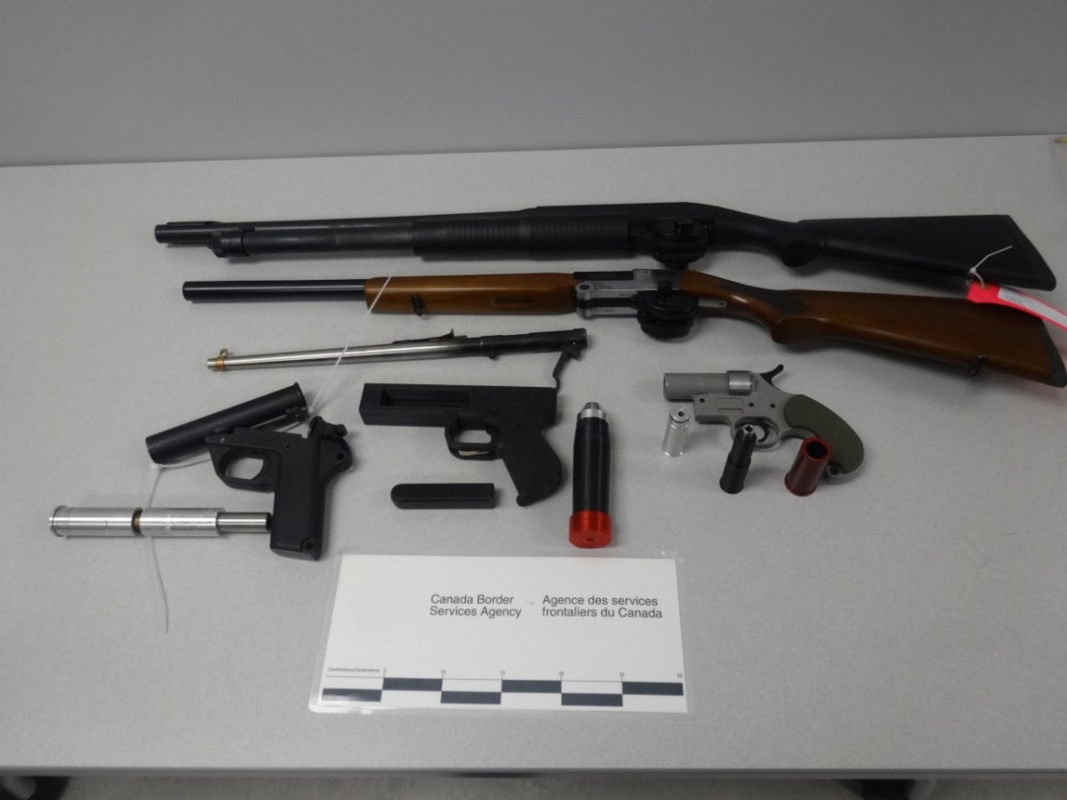 Various weapons and prohibited devices seized following a search in Porters Lake, Nova Scotia.