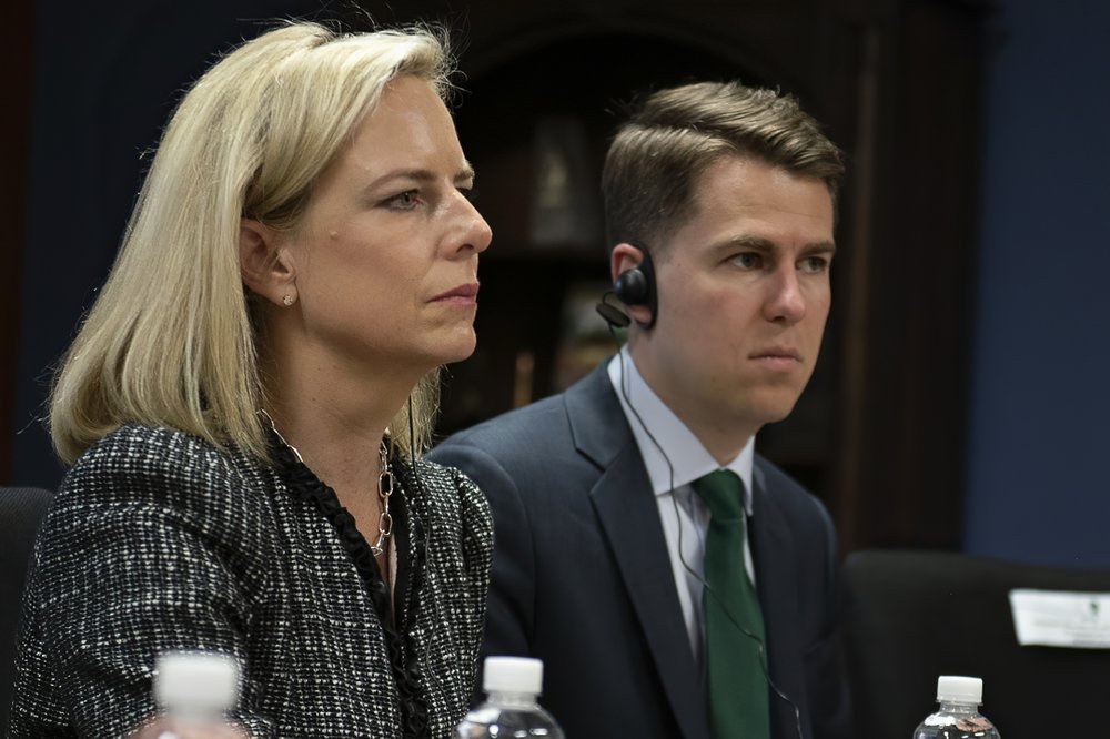 This March 27, 2018, provided by the Department of Homeland Security, then-Secretary of Homeland Security Kirstjen Nielsen and then-Department of Homeland Security chief of staff Miles Taylor, right, meet with Honduran President Juan Hernandez, not pictured, and security ministers from the Northern Triangle countries in Tegucigalpa, Honduras. Taylor, a former Trump administration official who penned a scathing anti-Trump op-ed and book under the pen name “Anonymous” made his identify public Wednesday, Oct. 28, 2020. 