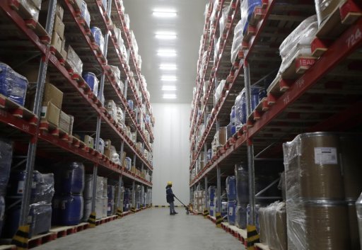 A worker moves boxes at Snowman Logistics, India’s largest cold storage company in Taloja, on the outskirts of Mumbai, India, Saturday, Oct. 17, 2020.