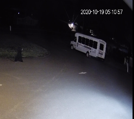 An individual in black is shown to approach the facility shortly before the fire began.