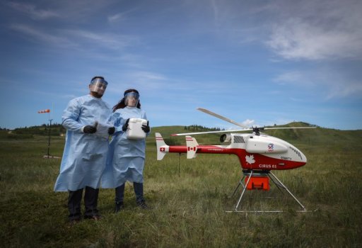 Calgary, Alberta – June 25, 2020 – Aaron Khan, executive director and CO for Stoney Health Services, left and Sara Ashoori, research assistant and drone pilot, SAIT, at the test flight on Stoney Nakoda First Nation on June 25, 2020.
