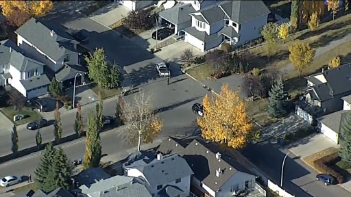 Calgary police on the scene of a collision involving a young child in northwest Calgary on Friday, Oct. 2.