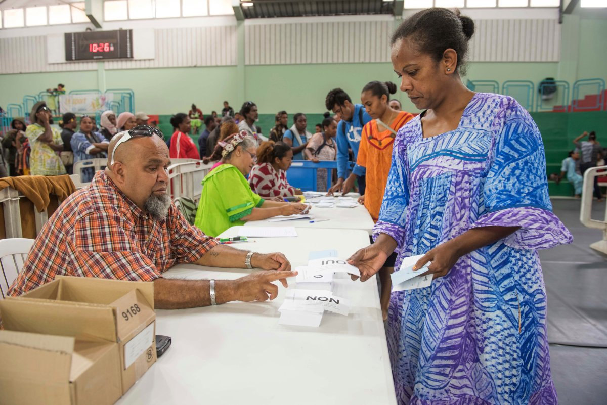 A woman participates in a referendum in Noumea, New Caledonia, Oct. 4, 2020, whether voters choose independence from France.