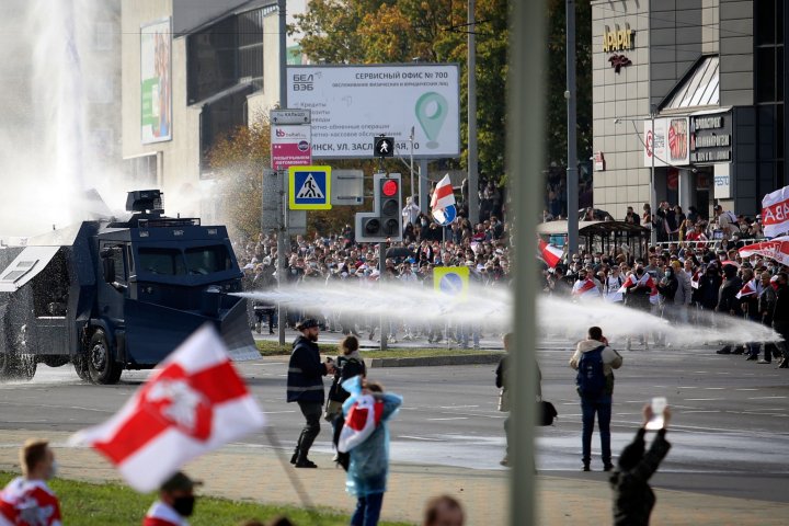 Belarusian police turn water cannons on protesters as thousands rally against Lukashenko