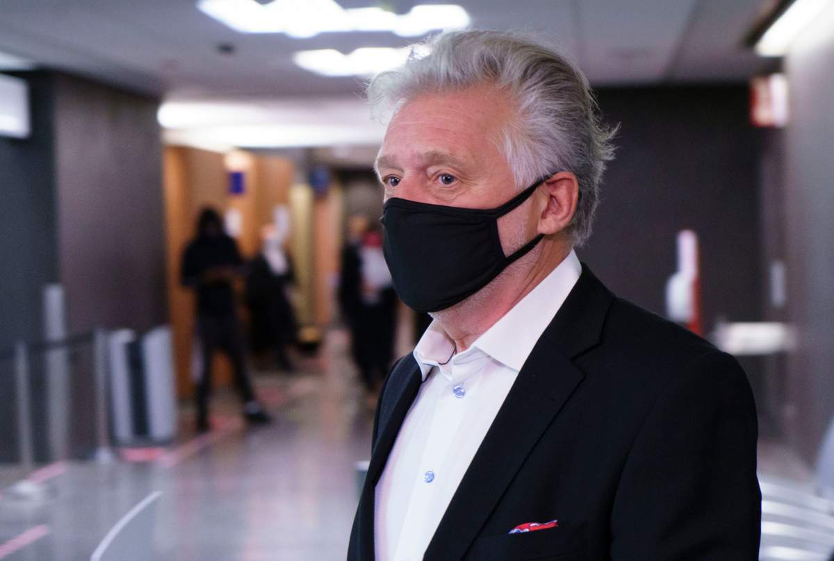 Just for Laughs founder Gilbert Rozon walks the hall of the courthouse as he arrives for the beginning of his sexual assault trial in Montreal on Tuesday, October 13, 2020. 