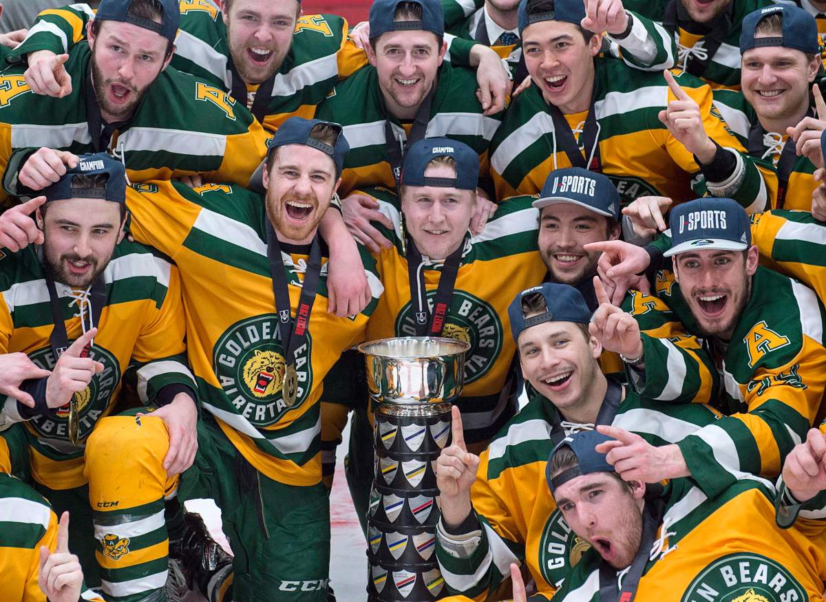 University of Alberta Golden Bears celebrate after defeating the St. Francis Xavier University X-Men 4-2 to win the USports University Cup at the Canadian university men's hockey championship gold medal game in Fredericton on Sunday, March 18, 2018. THE CANADIAN PRESS/Andrew Vaughan.