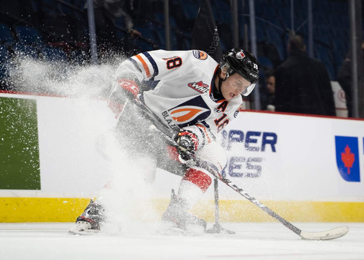 Team white centre Connor Zary (18) controls the puck during the Kubota OHL/NHL Top Prospects team white on-ice skills testing in Hamilton, Ont., on Wednesday, Jan. 15, 2020.