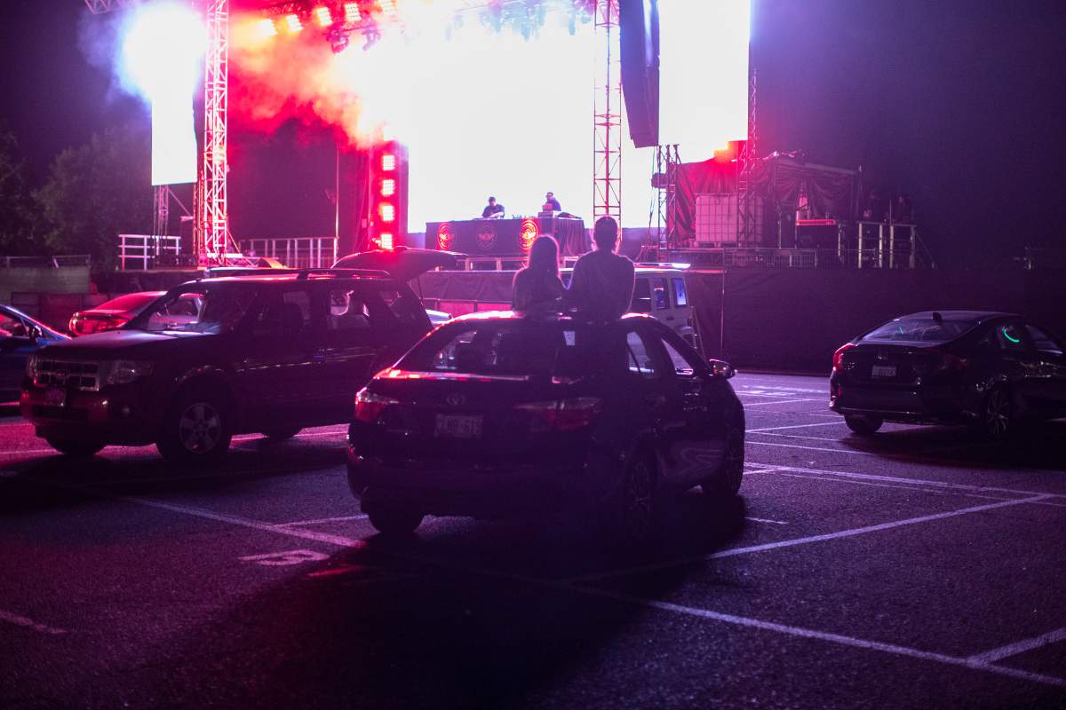 Fans watch A Tribe Called Red play at CityView Drive-In, in Toronto, on Thursday, August 6, 2020, as many indoor venues remain  closed due to the COVID-19 pandemic. 