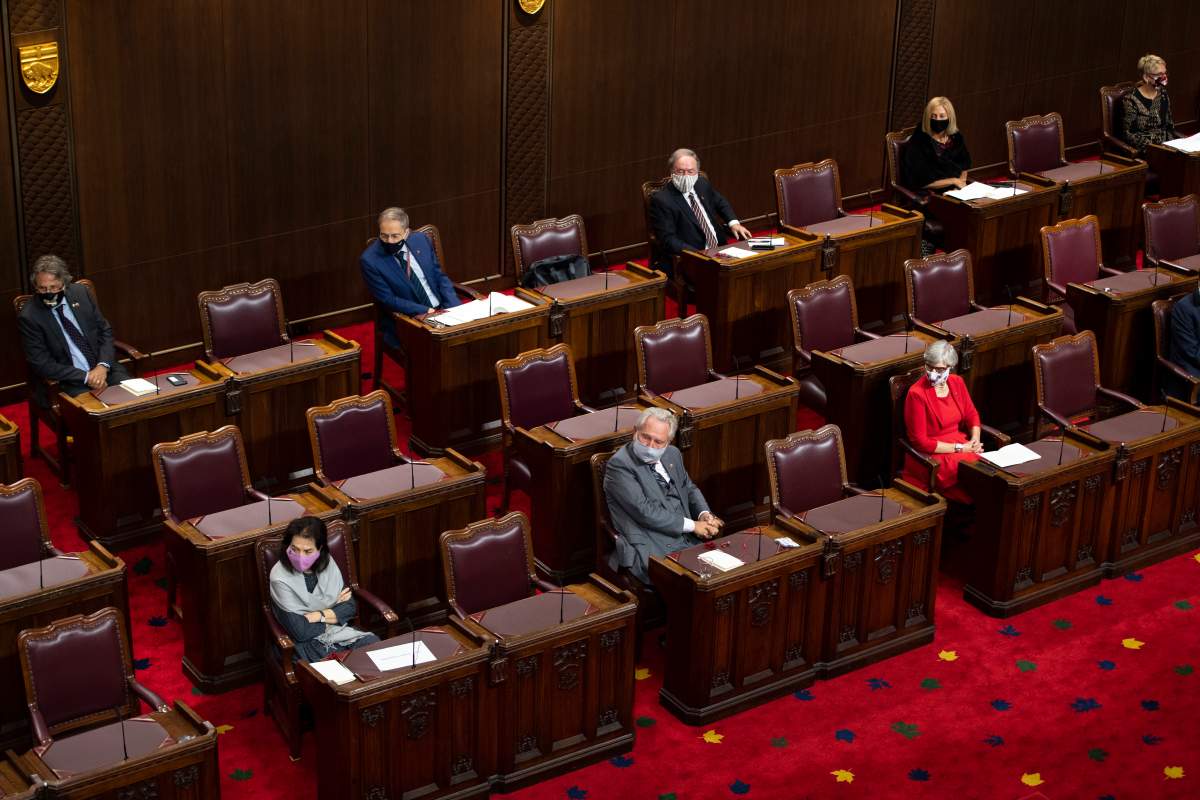 FILE - Senators sit physically distanced as they listen to Gov. Gen Julie Payette deliver the Speech from the Throne at the Senate of Canada Building in Ottawa, on Wednesday, Sept. 23, 2020. 