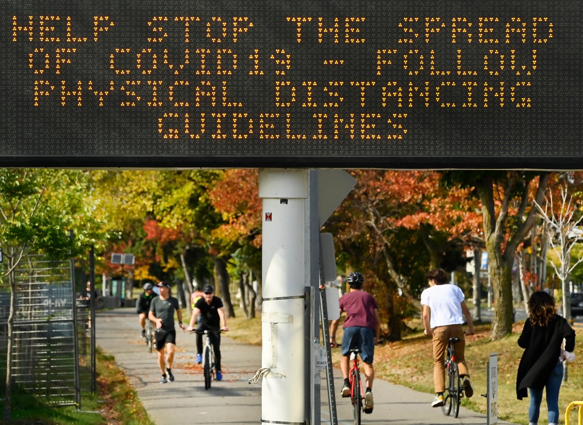 People get exercise along the lakeshore path on Lake Ontario on a fall day during the COVID-19 pandemic in Toronto on Tuesday, September 29, 2020. 