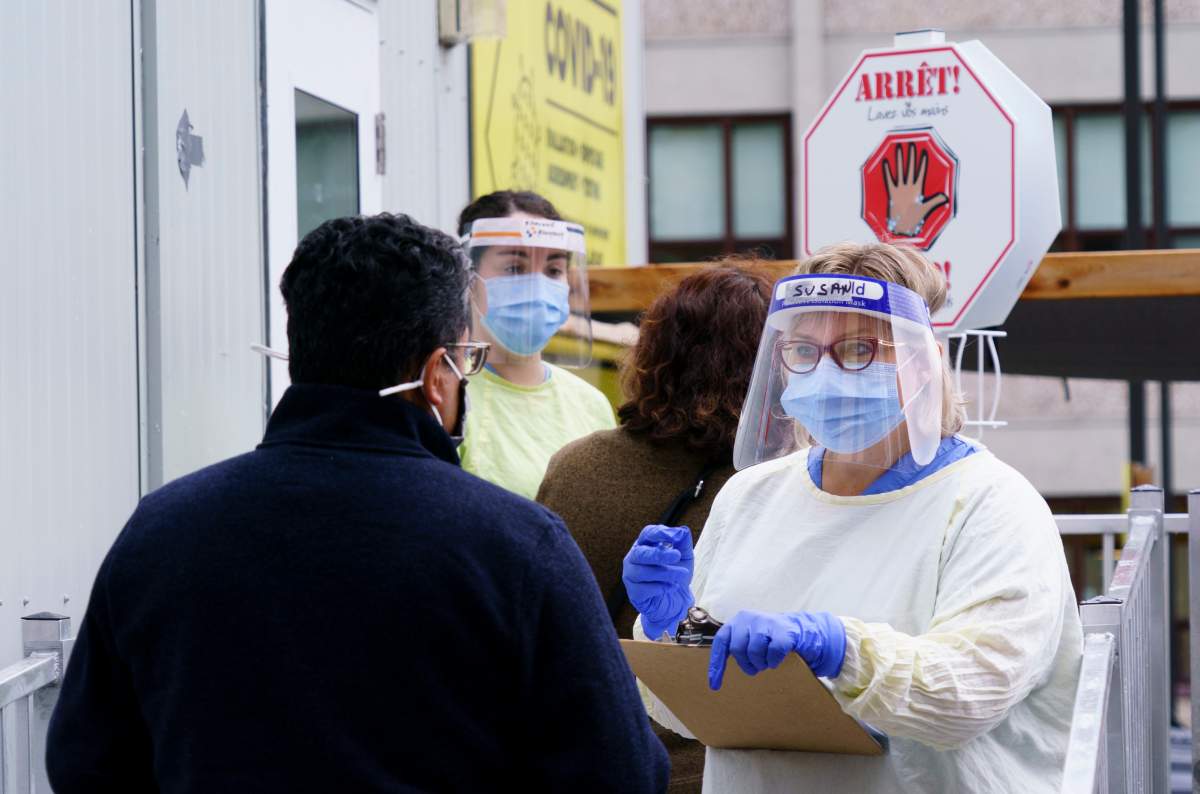 Nurses greet patients at a COVID-19 walk-in clinic in Montreal, on Tuesday, Sept. 29, 2020.