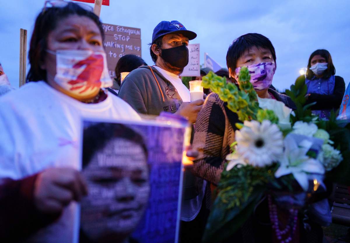 Carol Dubé, husband of Joyce Echaquan who died at the local hospital over the weekend, and her mother Diane Echaquan Dubé, right, attend a vigil in front of the hospital in Joliette, Que. on Tuesday, September 29, 2020. 