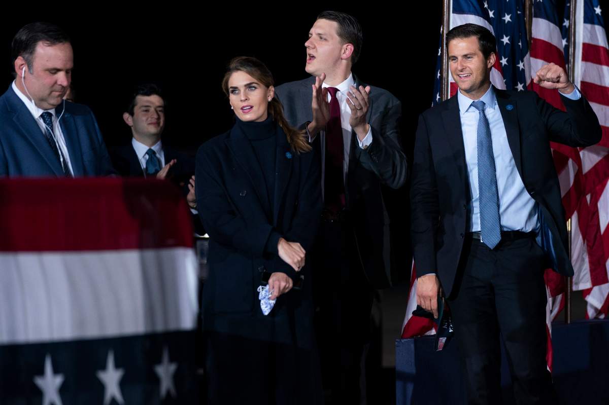 From left, White House director of social media Dan Scavino, Counselor to the President Hope Hicks, special assistant to the President and White House trip director William Russell, and director of the White House personnel John McEntee listen as President Donald Trump speaks during a campaign rally at Harrisburg International Airport, Saturday, Sept. 26, 2020, in Middletown, Pa.