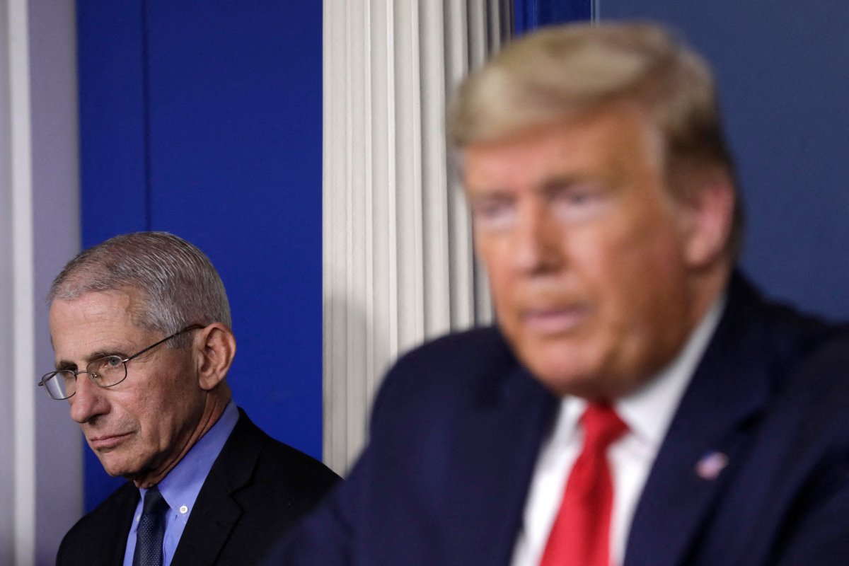 File photo dated March 26, 2020 of President Donald Trump speaks next to Director of the National Institute of Allergy and Infectious Diseases Dr. Anthony Fauci during a press briefing on the Coronavirus COVID-19 pandemic at the White House in Washington, DC, USA. 