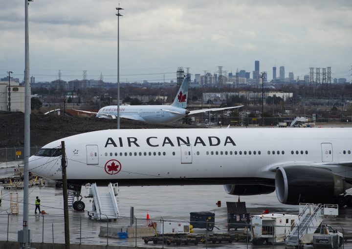 Air Canada airplanes sit on the tarmac at Pearson International Airport in Toronto on Friday, March 20, 2020. 