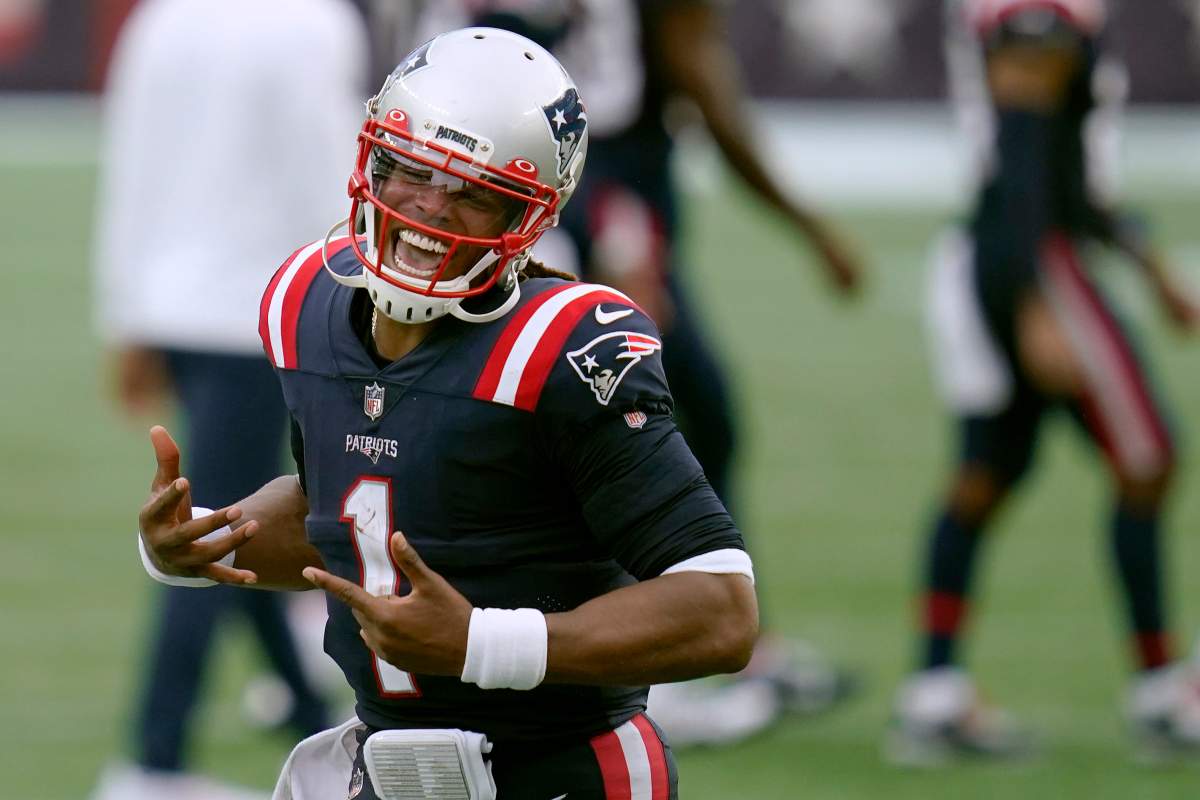 New England Patriots quarterback Cam Newton celebrates after defeating the Las Vegas Raiders in an NFL football game, Sunday, Sept. 27, 2020, in Foxborough, Mass.