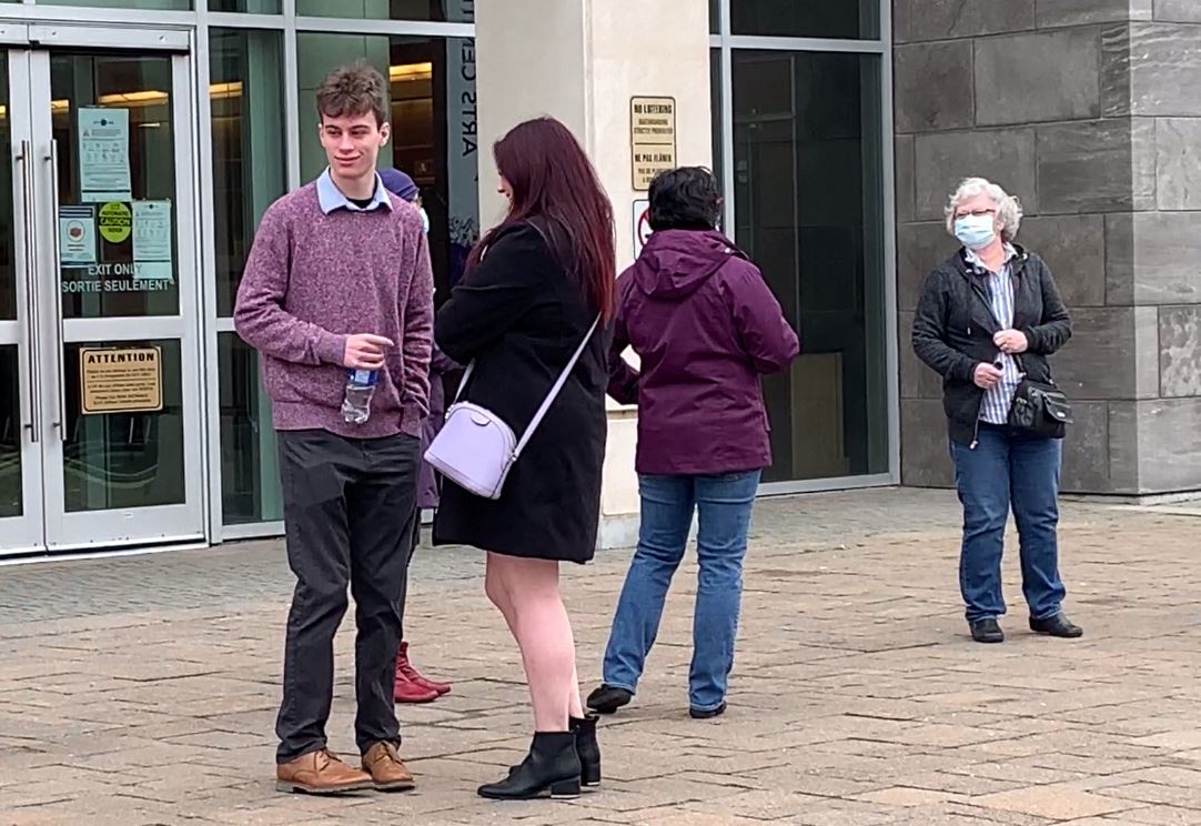 Jordan talks to Sarah Taylor outside the courthouse after her testimony.