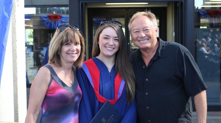 Deb and Roger with their daughter Roxanne at her graduation. Photo submitted.