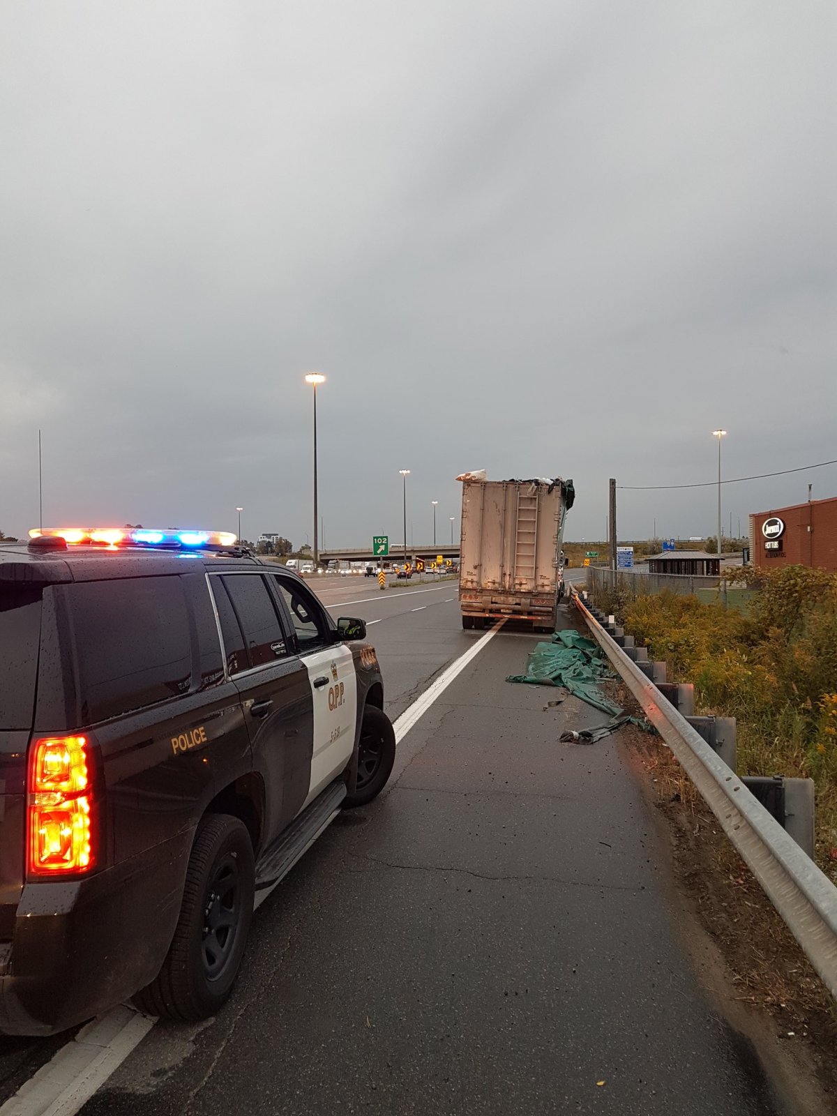 Commercial truck driver charged with impairment following crash on QEW at Walker's Line. 