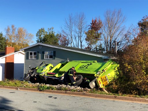 A dump truck turned over on its side in Lower Sackville, N.S., on Oct. 15, 2020.