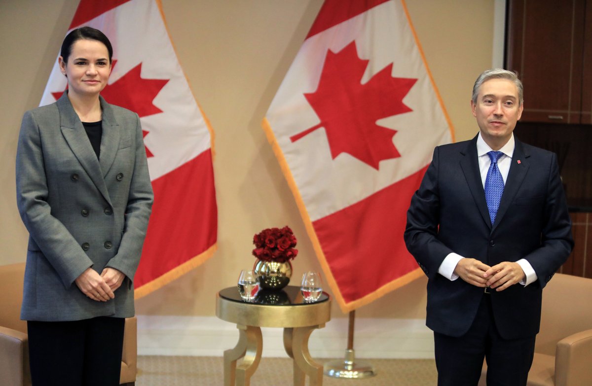 Canadian Foreign Minister François-Philippe Champagne poses with Belarusian opposition leader Sviatlana Tsikhanouskaya (L) prior to their meeting at the Kempinski hotel in Vilnius, Lithuania, on Oct. 16, 2020. 