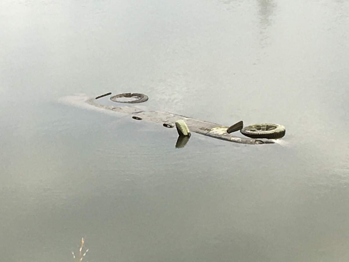 Winnipeg police were investigating a vehicle found in the water near Churchill Drive and Osborne Street Monday.