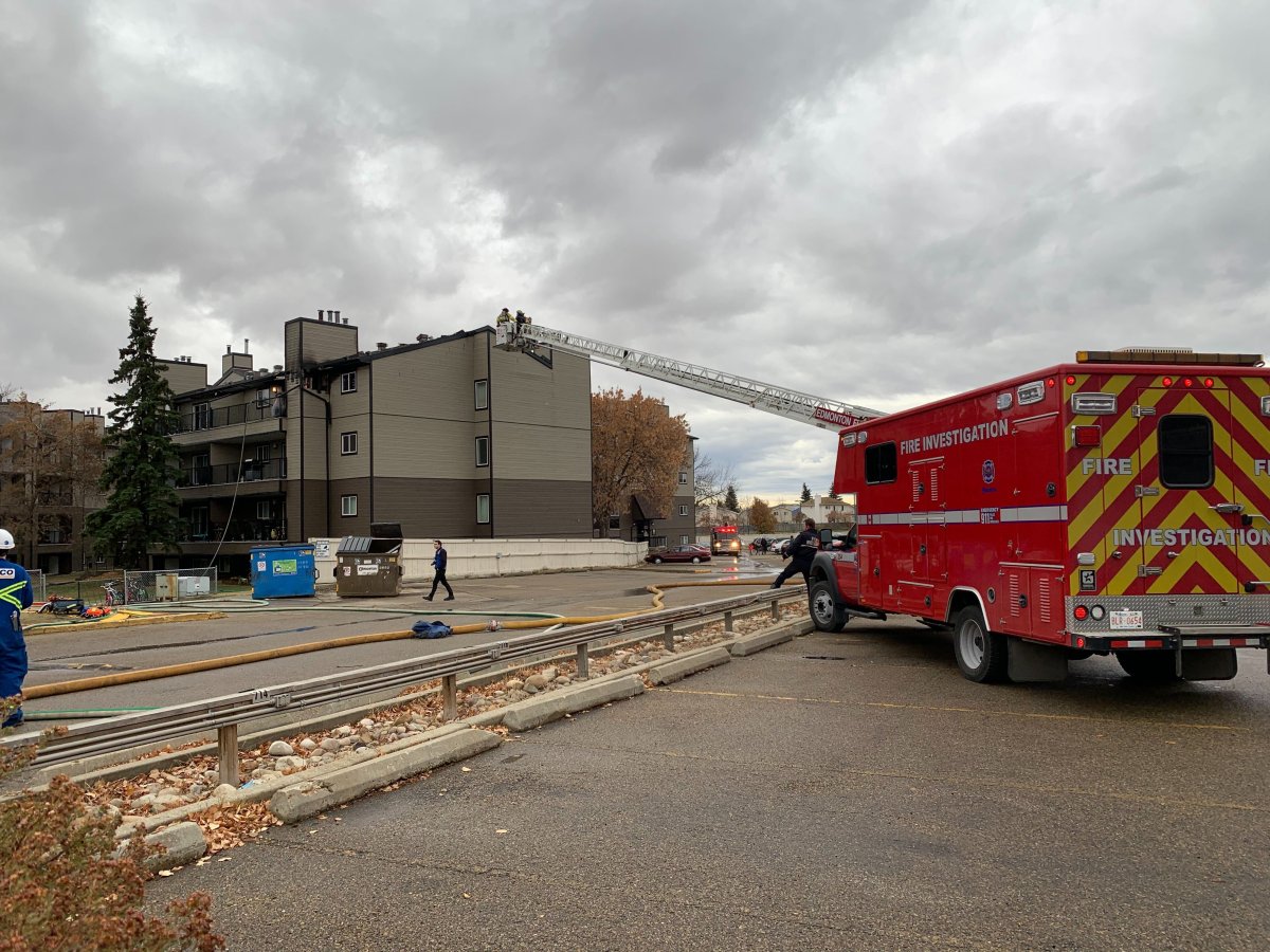 Edmonton firefighters battle a blaze at an apartment building in the area of 40 Street and 26 Avenue Tuesday, Oct. 27, 2020.