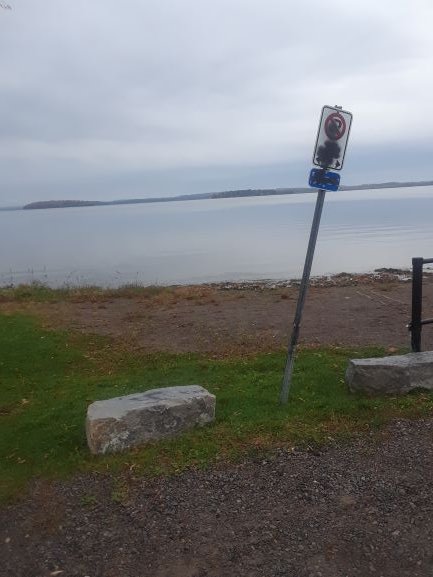 A no-parking sign at the Harwood dock vandalized.