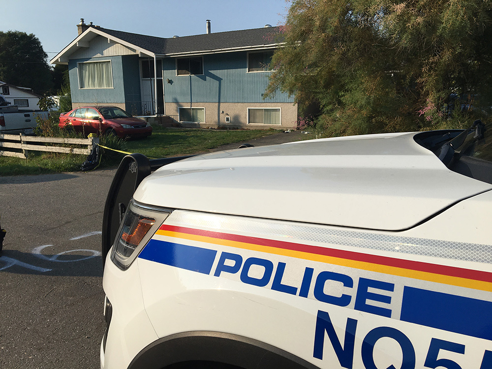 RCMP vehicles remain at the scene along Kalamalka Road in Coldstream, near the intersection of Howe Drive.