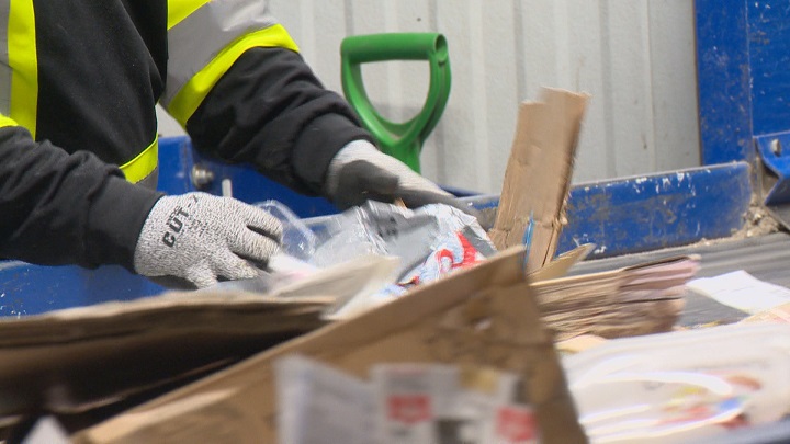 File: A worker sorting through recycling in Lethbridge on Oct. 8, 2020.