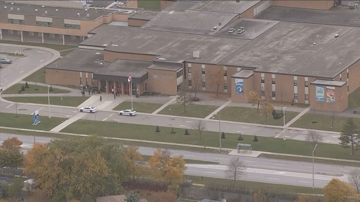 A photo of police on scene at Chinguacousy Public Secondary School.
