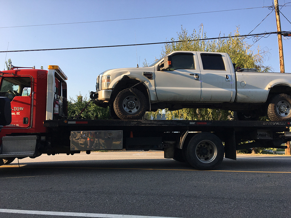 A truck was towed from one of the houses on Kalamalka Road on Saturday.